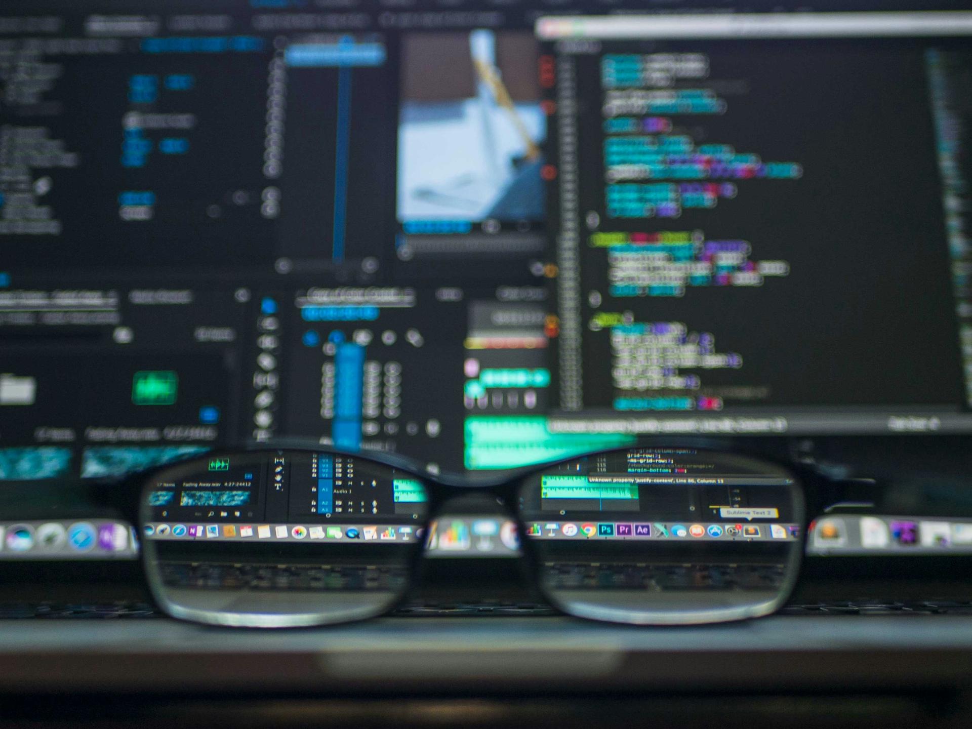 Multiple screens displaying IoT telemetry and operational dashboards