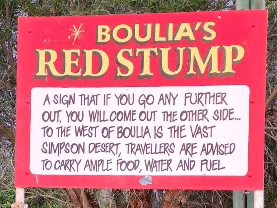 Boulia's Red Stump sign, advising travellers heading west into the Simpson Desert to carry ample food, water and fuel