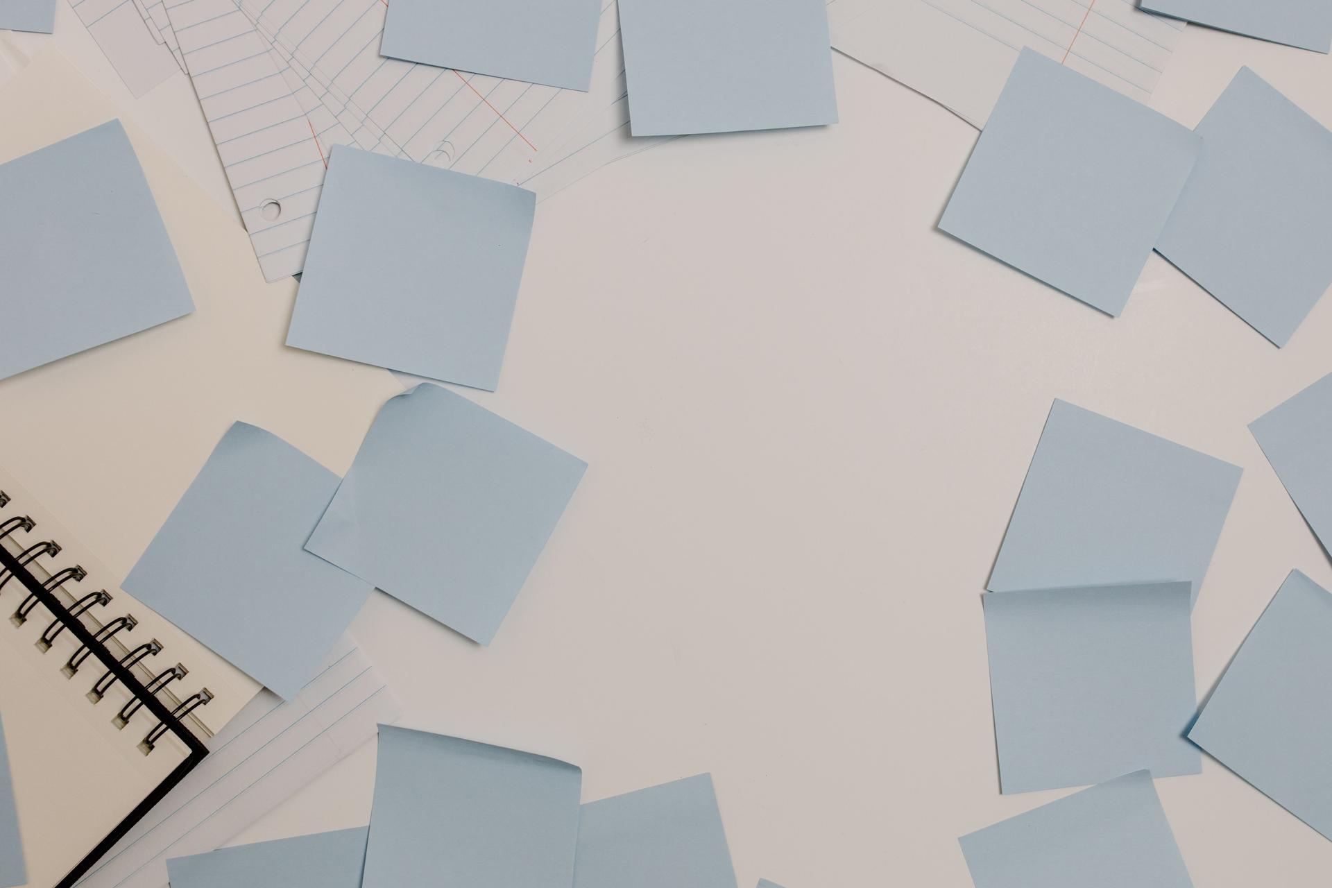 A whiteboard with a reframed problem statement written as a 'how might we' question